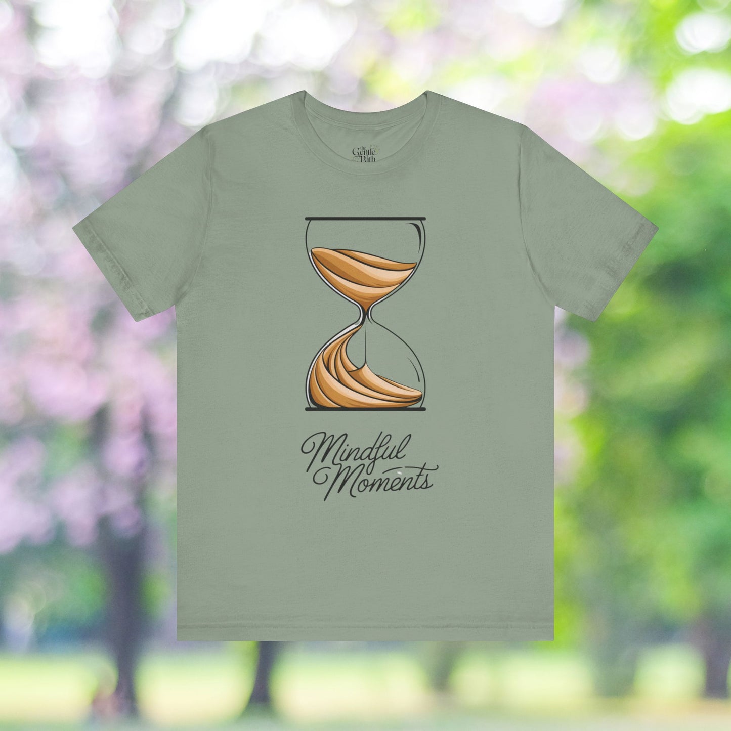 Green t-shirt with hourglass graphic for mindful moments.