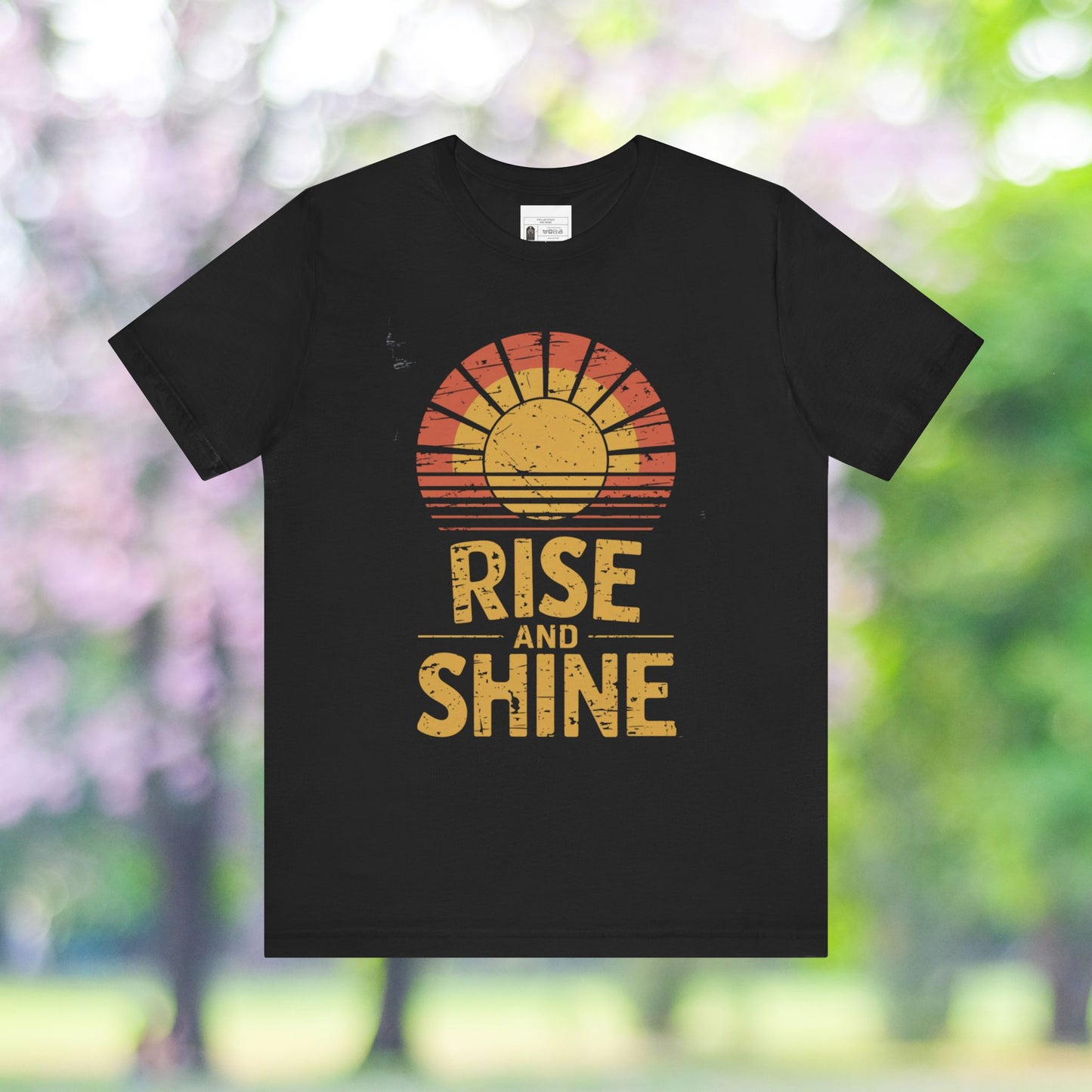 Black unisex t-shirt with a retro Rise and Shine motivational graphic.