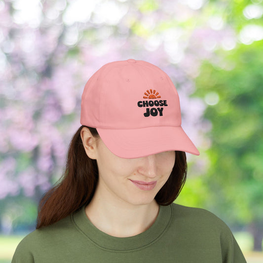 Pink dad hat with "Choose Joy" graphic, adjustable cap.