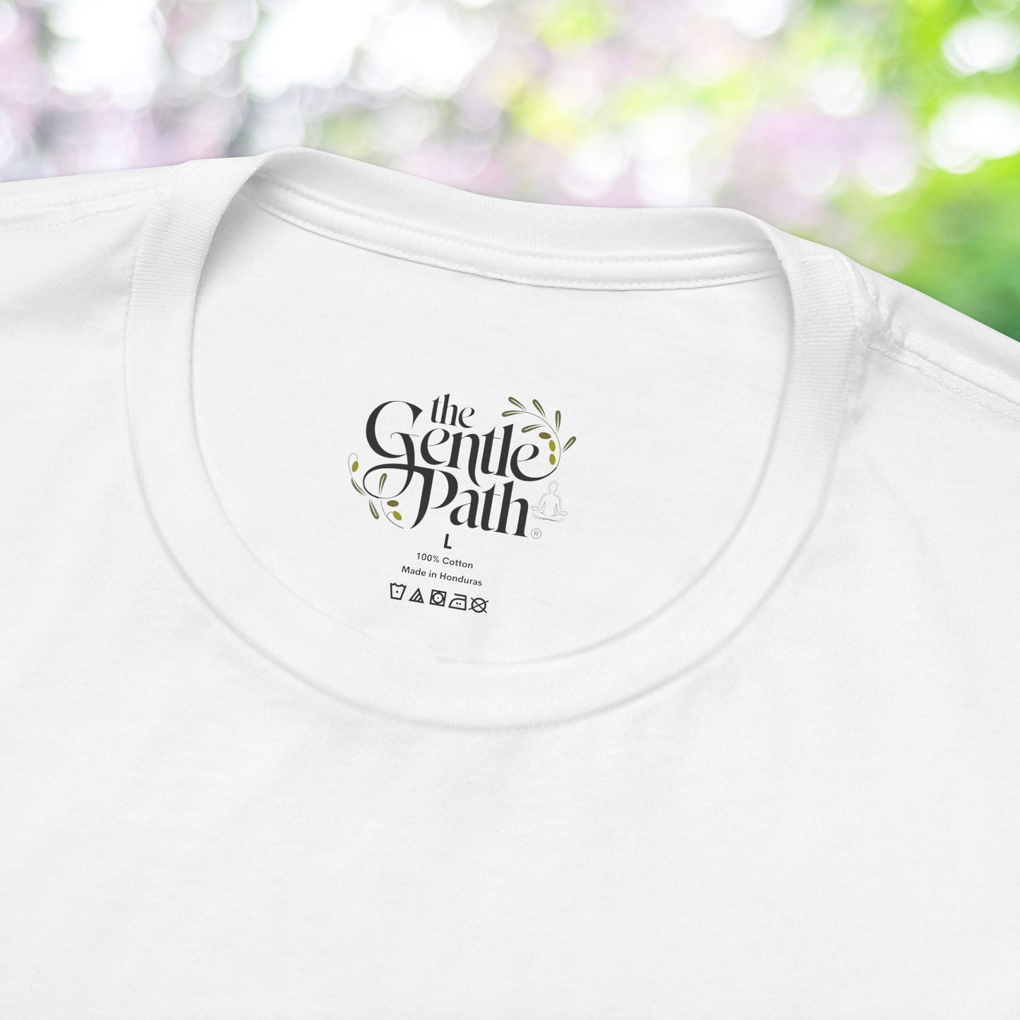 White short sleeve tee with 'The Gentle Path' logo on the label.