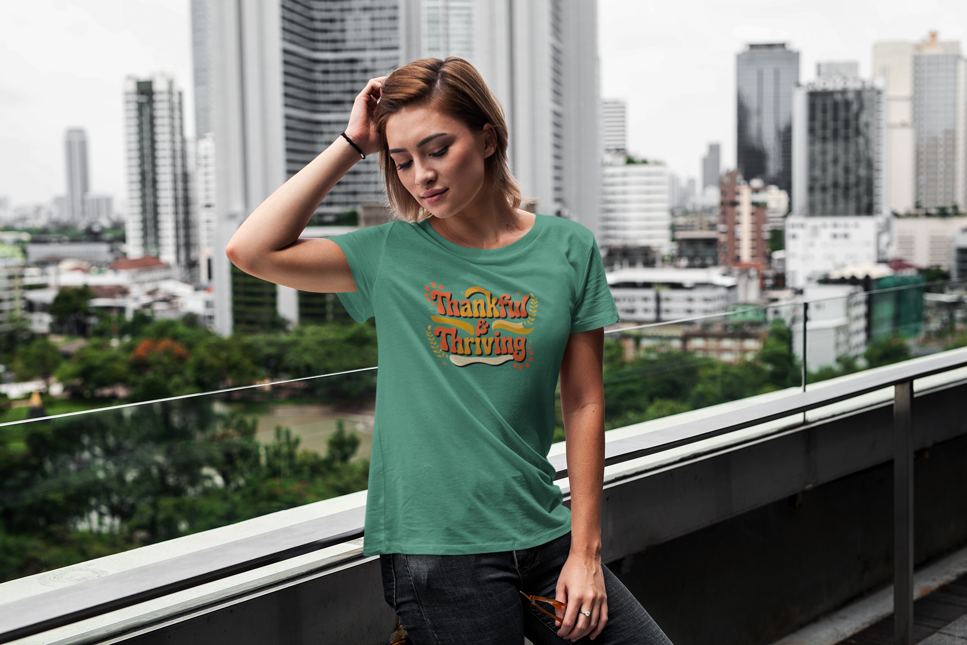 Green short sleeve tee with 'Thankful Thriving' fall design.