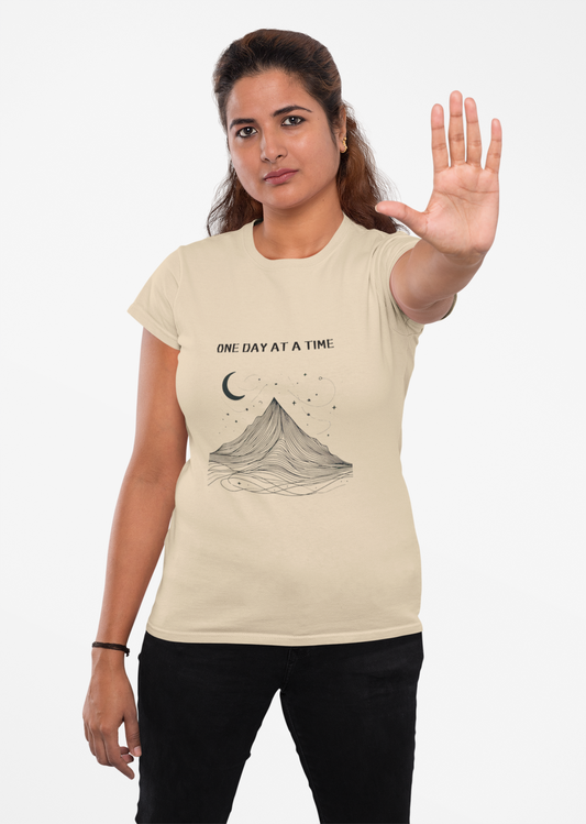 Beige tee with minimalist mountain and moon graphic design for self-care.