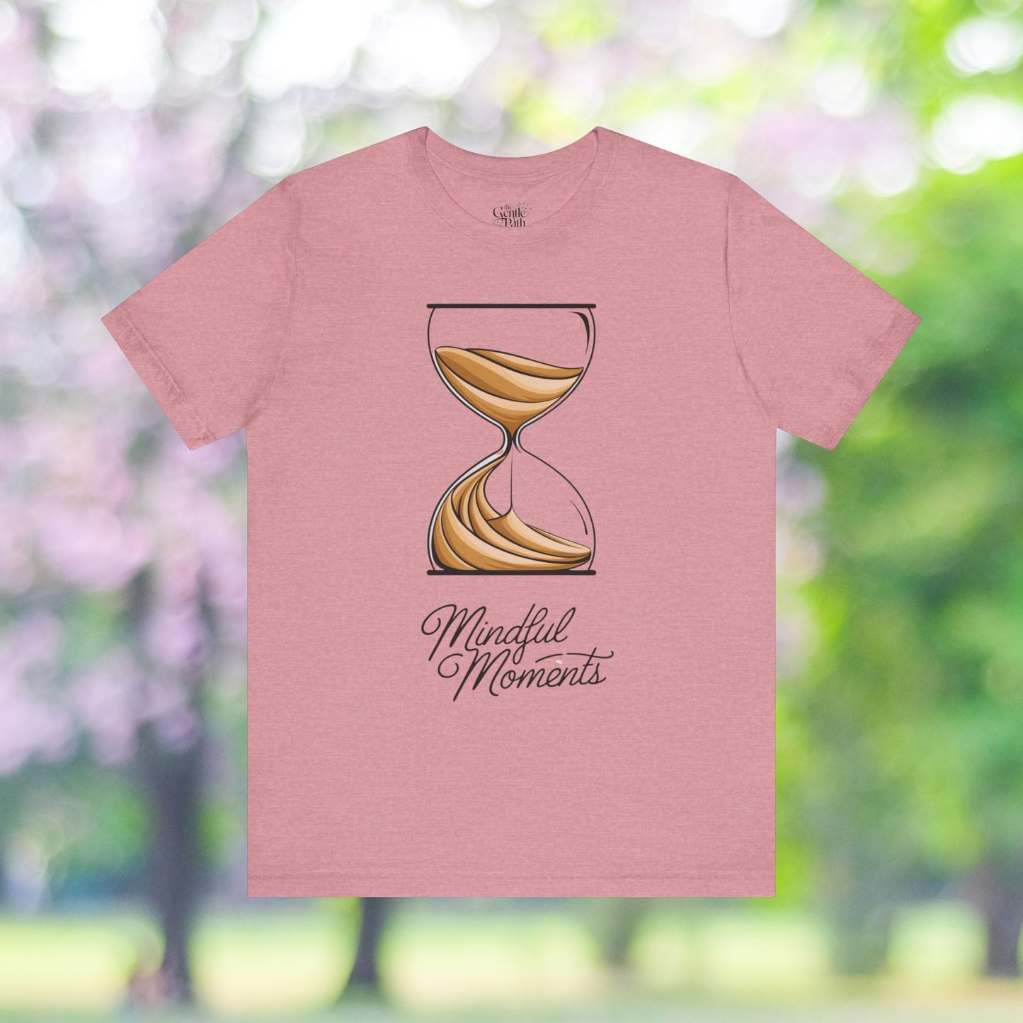 Pink t-shirt with hourglass graphic and Mindful Moments text.