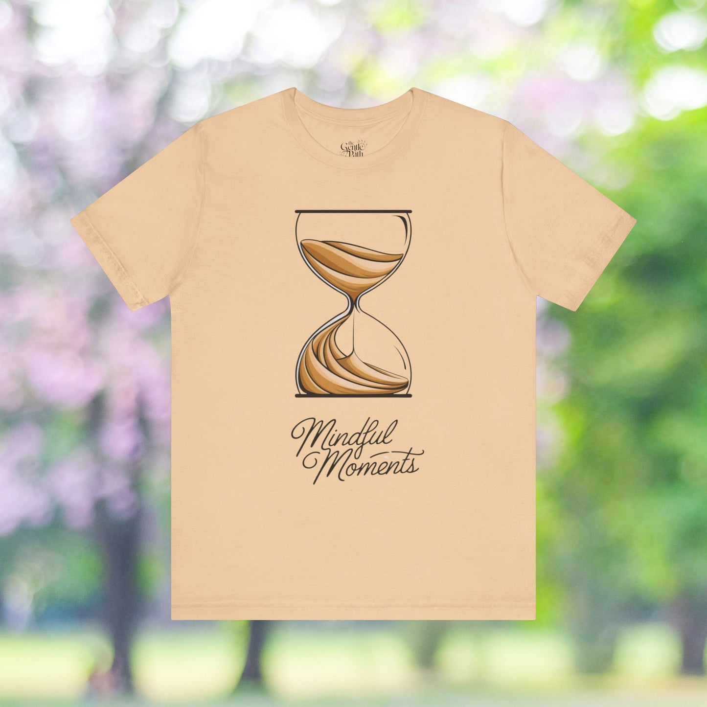 Beige t-shirt featuring a 'Mindful Moments' hourglass design.