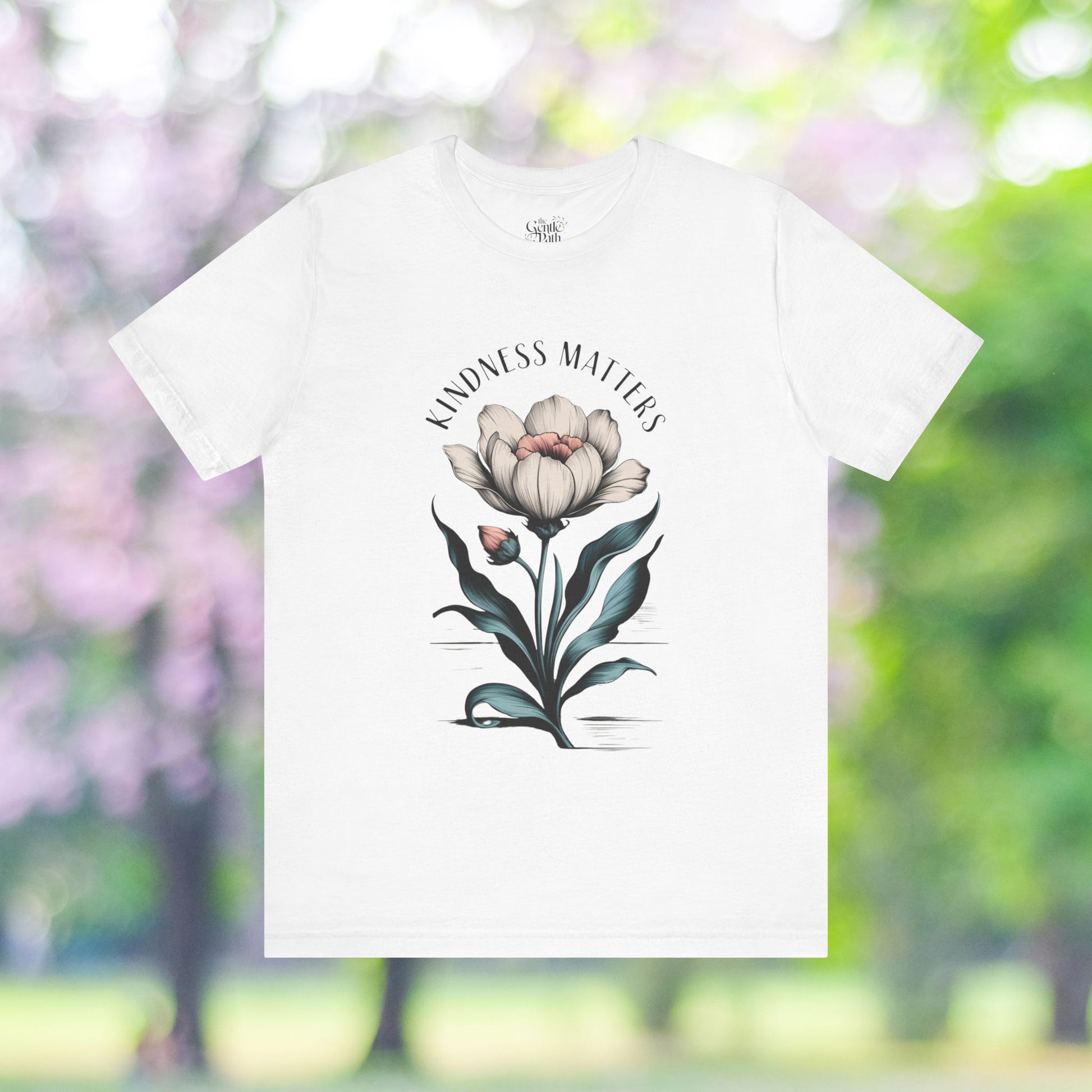 Kindness Matters t-shirt featuring a floral blossom design.