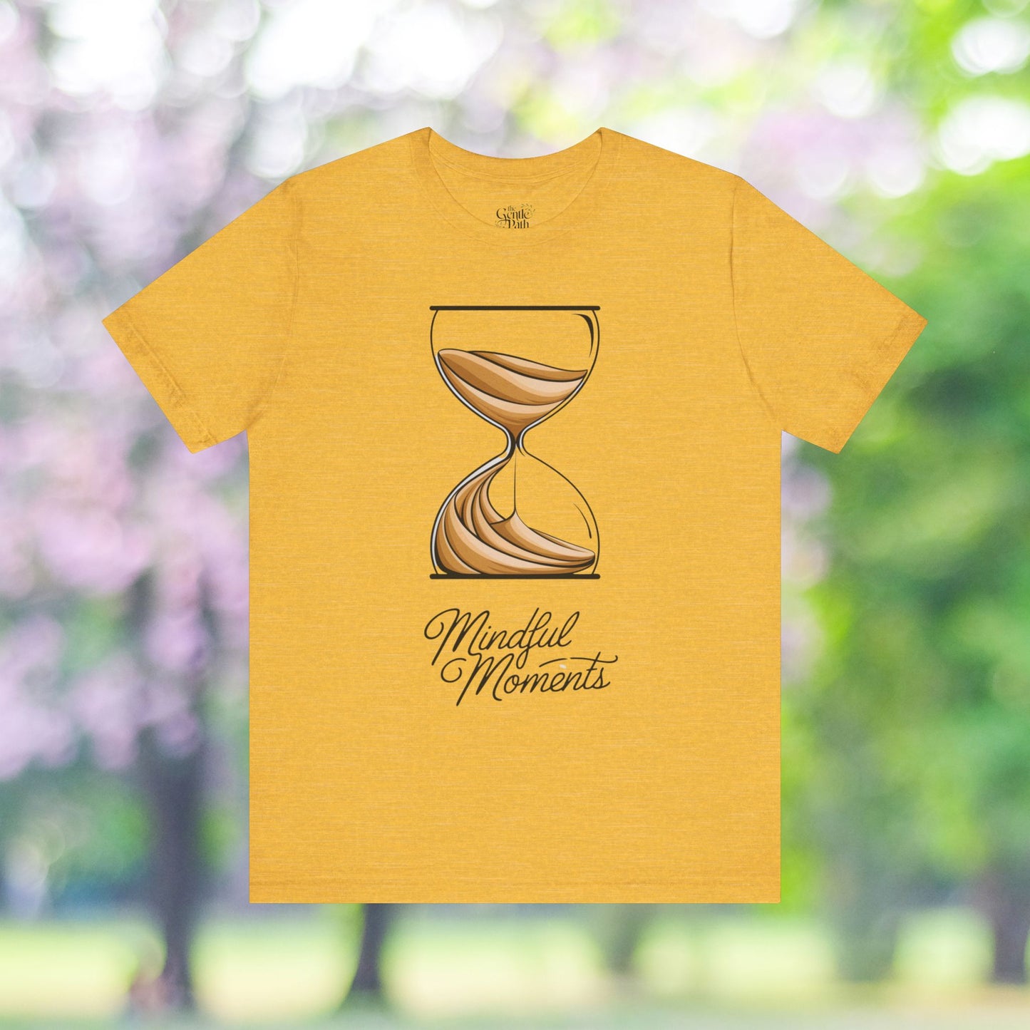 Golden yellow t-shirt with hourglass graphic and Mindful Moments text.