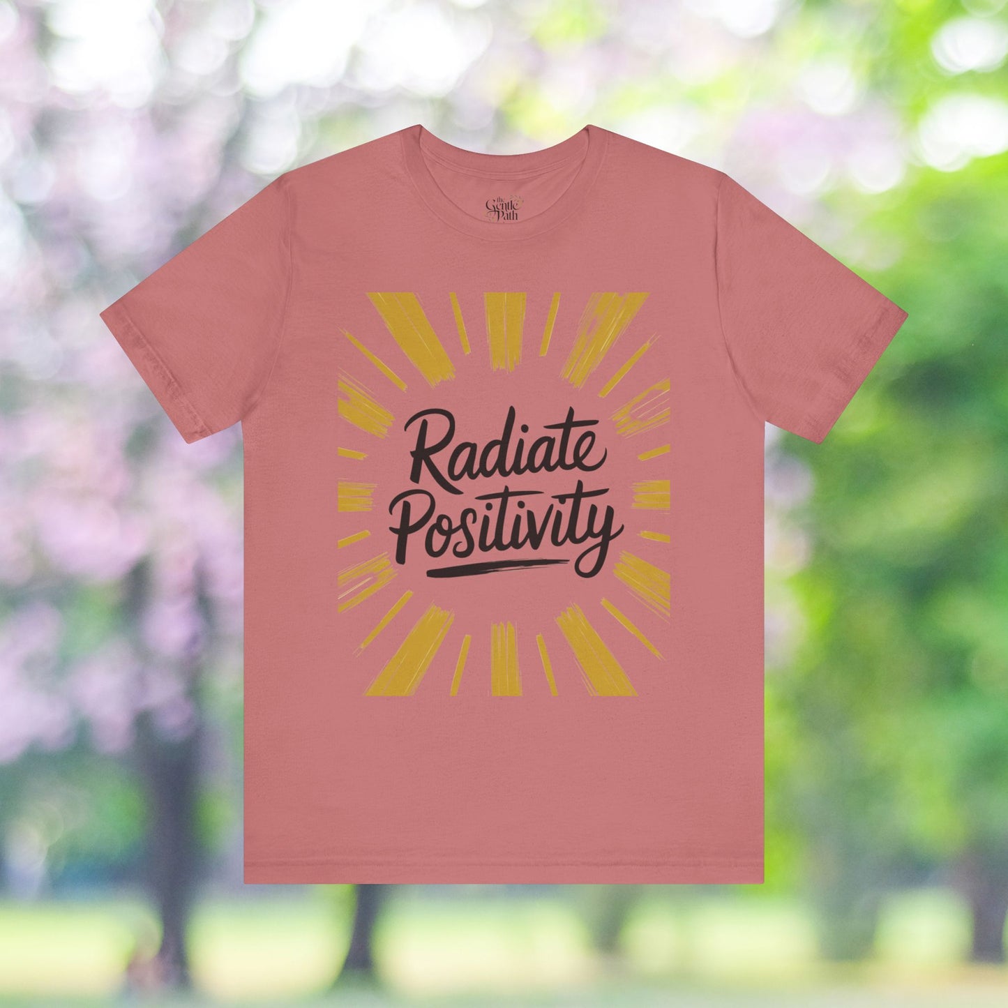 Pink tee with 'Radiate Positivity' graphic print