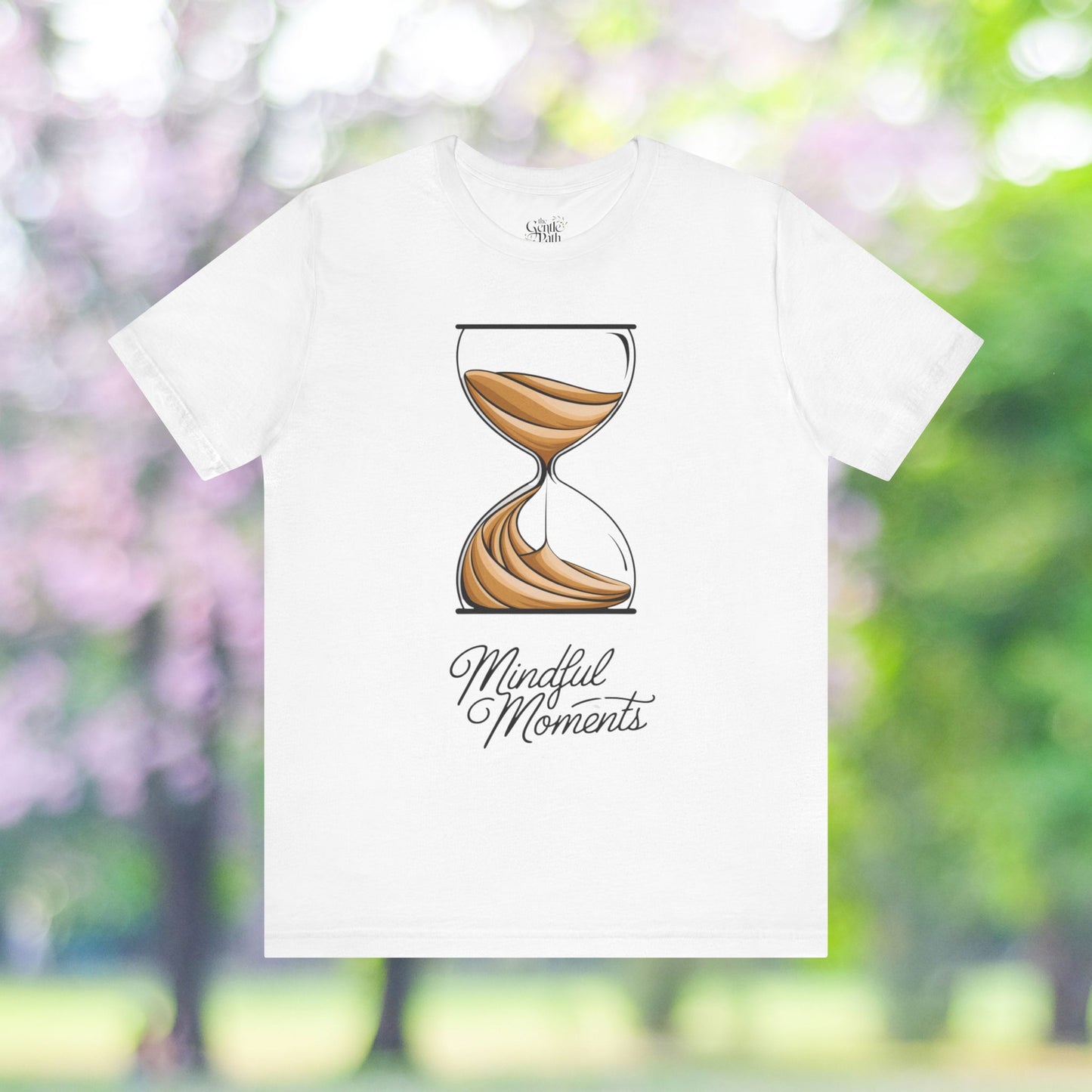 White tee with hourglass graphic and 'Mindful Moments' text.