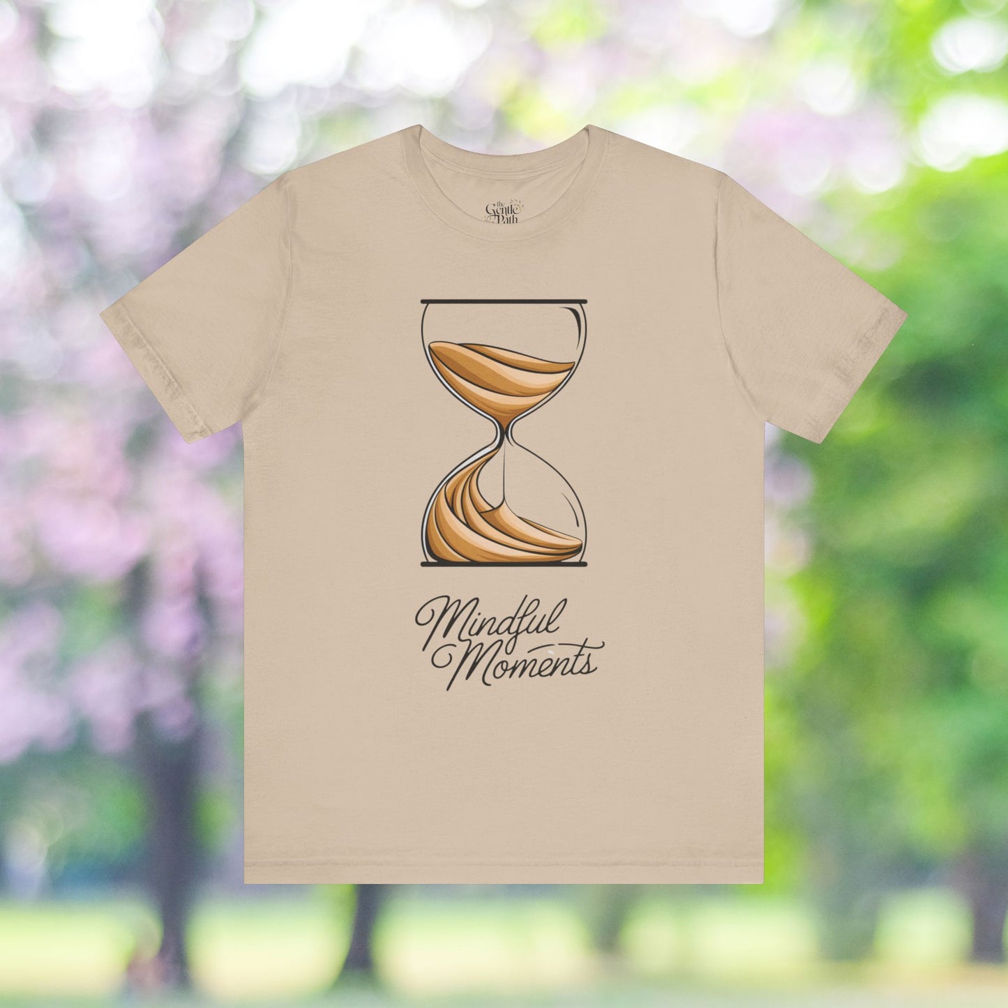 Beige tee featuring sand timer and Mindful Moments graphic.