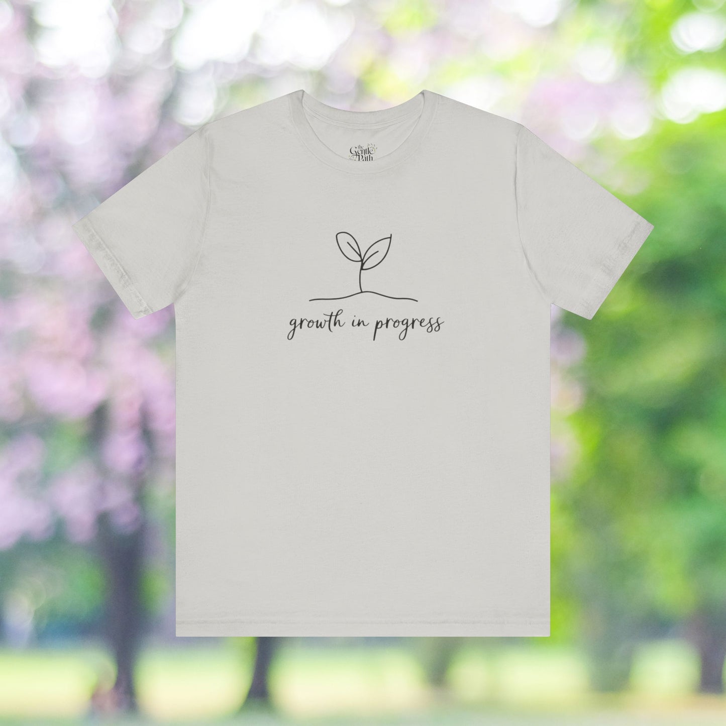 Minimalist tee with growth in progress plant design.