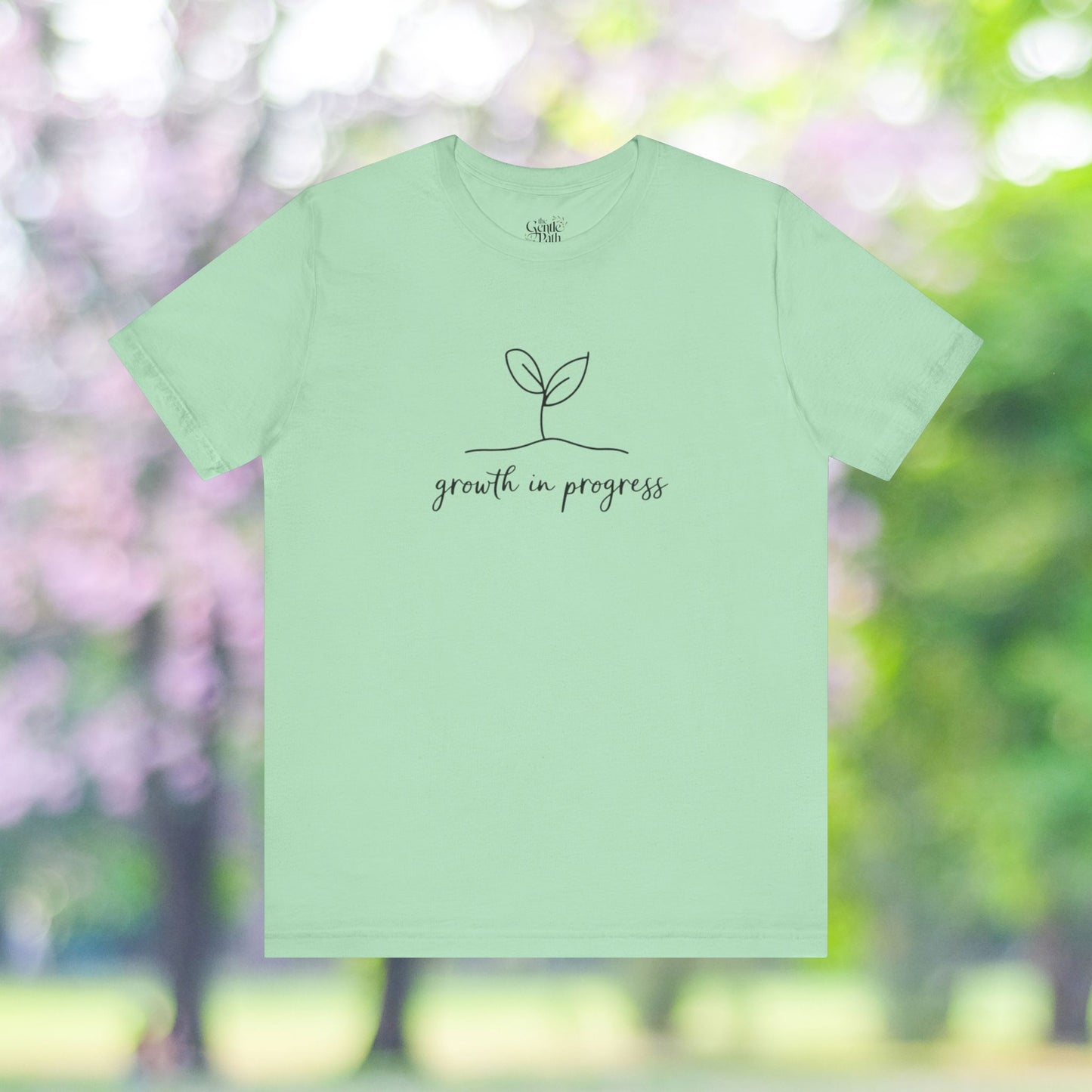 Growth in progress tee; Minimalist sprout graphic.