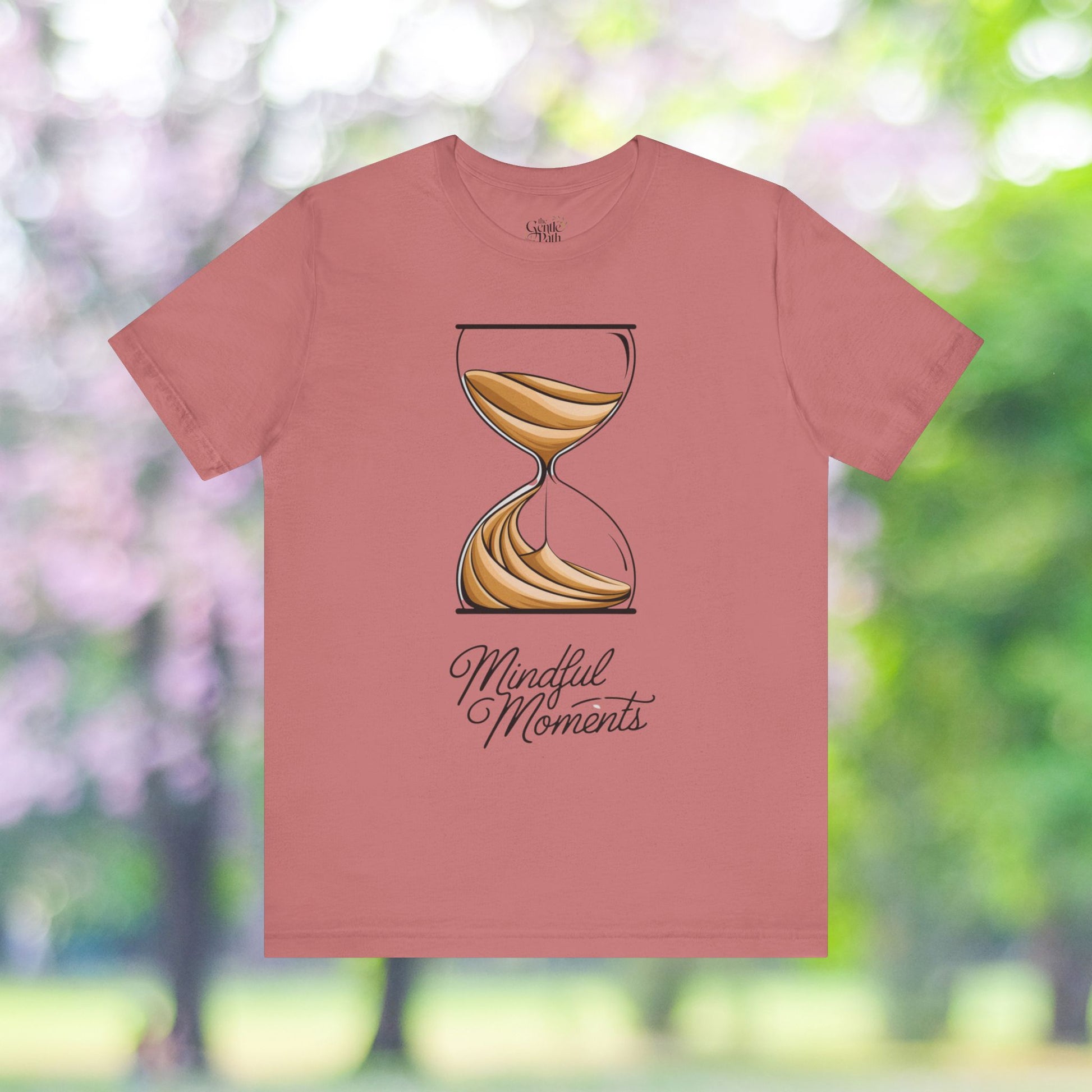 Pink T-shirt with hourglass graphic, Mindful Moments.