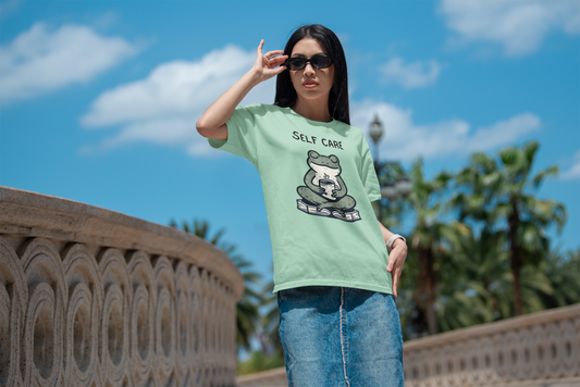 Bella Canvas tee with meditating frog graphic for self-care aesthetic.